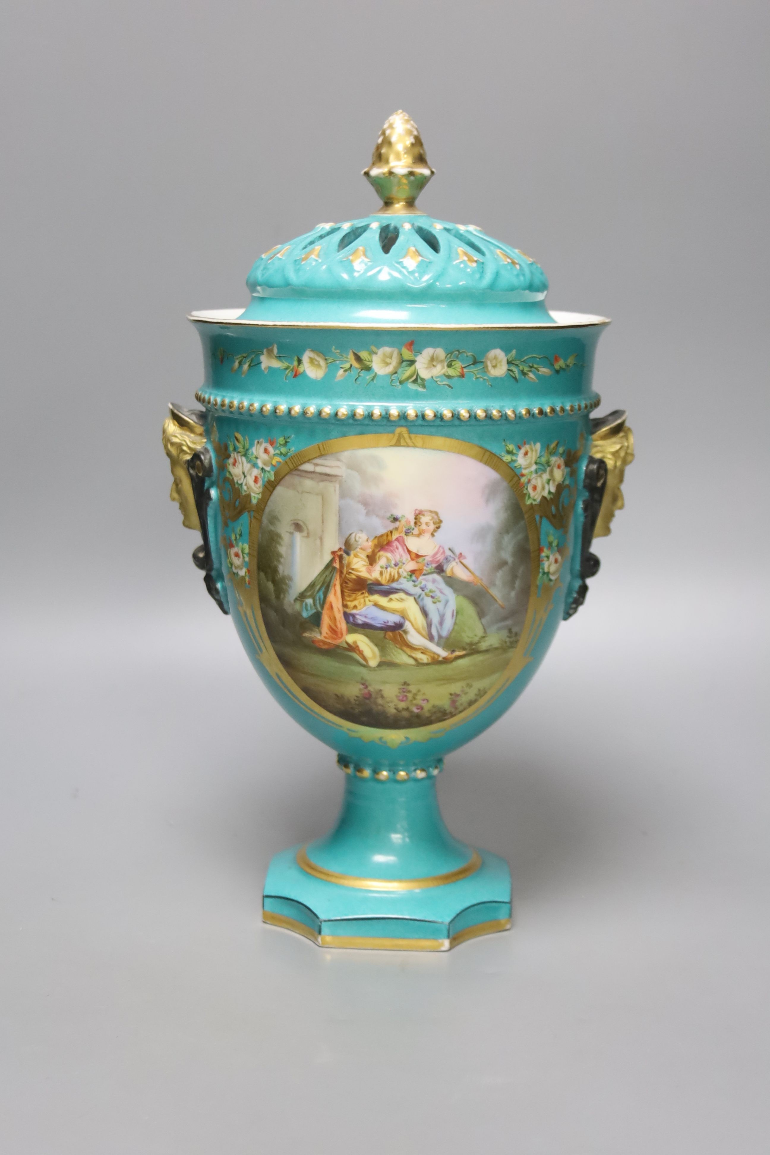 A 19th century French porcelain pot pourri vase, turquoise green ground with a pierced cover, height 30cm overall